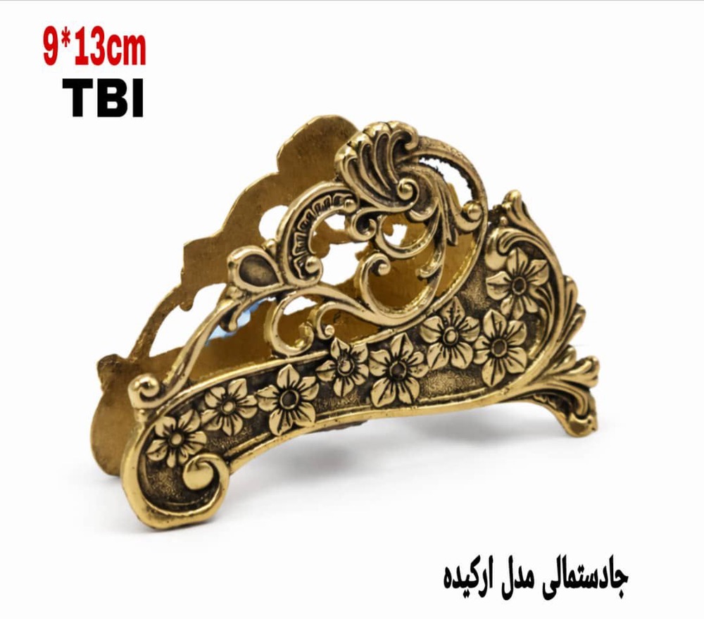جادستمالی رومیزی برنجی مدل ارکیده با نقوش برجسته گل و شاخ و برگ‌های اسلیمی محصول برند متالوکس