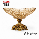 میوه خوری مدل کایا با کاسه کریستالی شامپاینی تراشخورده و پایه برنجی سنگین با طرح گلهای برجسته، محصول برند متالوکس